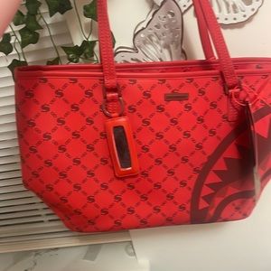 red sprayground tote bag